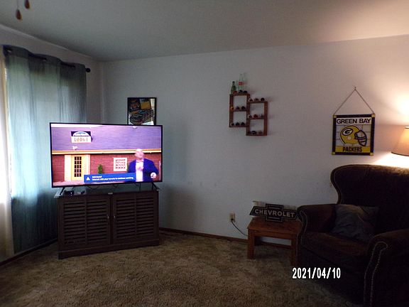 Large living room. House is about 40 years old. Home is fully carpeted.