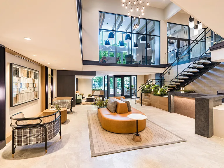Flooded with natural light and filled with mid-century flair, this welcoming lounge invites you to relax, connect, or simply take it all in.
