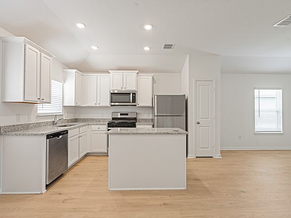 Granite countertops and stainless steel appliances in the kiichen