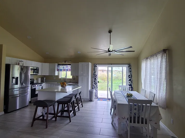 New, beautifully decorated kitchen with Mexican Talavera art. 
4 sitting stools for central Kitchen Island. 
Ample center island for breakfast, baking and organizing your groceries. 
Tall pantry. 
Six seat long dinning table.