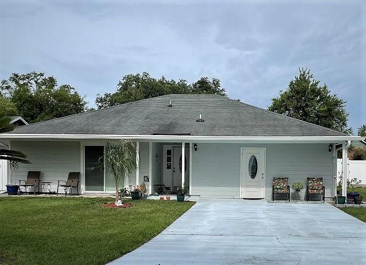 Private entrance on the left, sliding door, covered porch, front yard