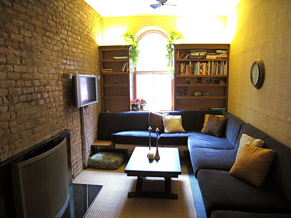 Den with built in wrap-around sofa, included flatscreen with bose, & fireplace