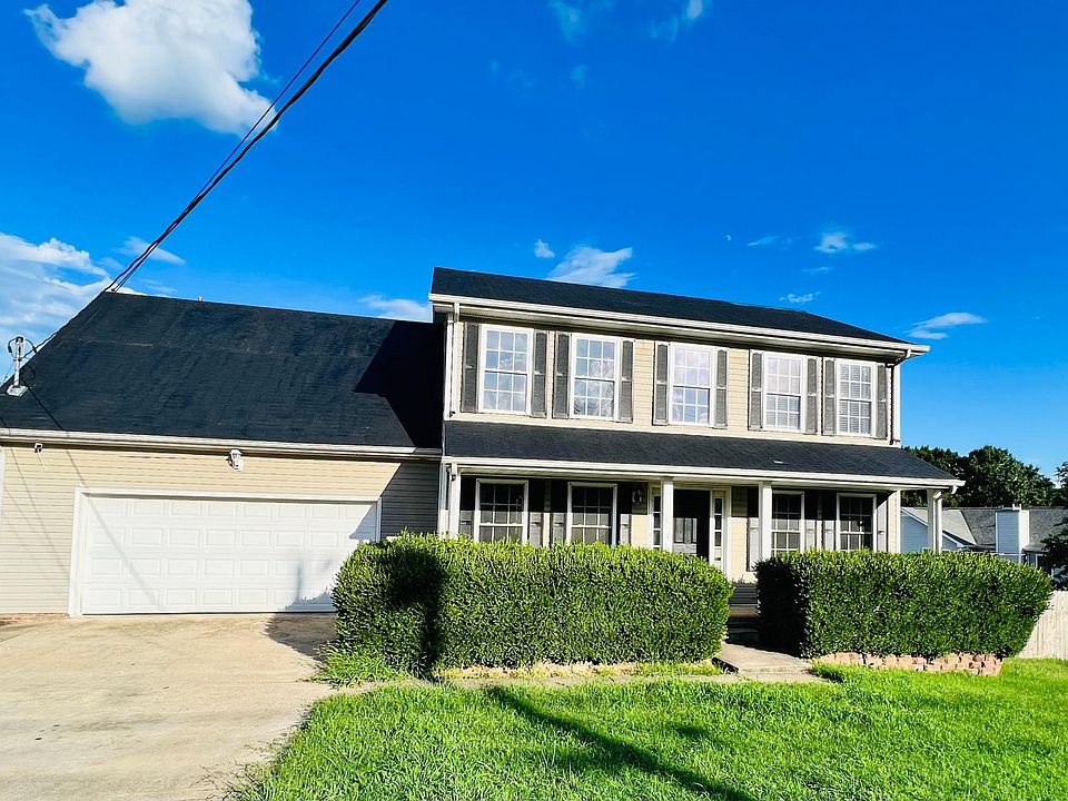 Beautiful Home with lots of room , front Porch and 2 car garage