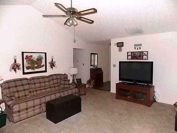 Great Room. 19 X 16 Great room with cathedral ceiling and brick fireplace.