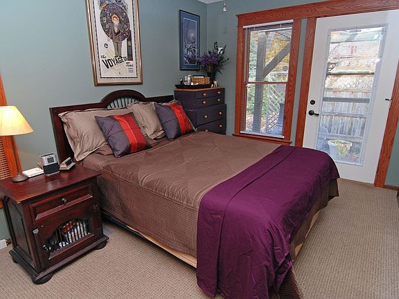 Bright and open master bedroom with door to private patio. 