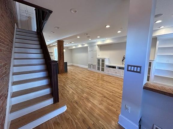 Front entry area large enough for coat tree and shoe storage.