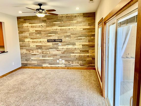 Living Room with wood plank wall, Carpet has been removed - now w/original oak floors (not in pic)