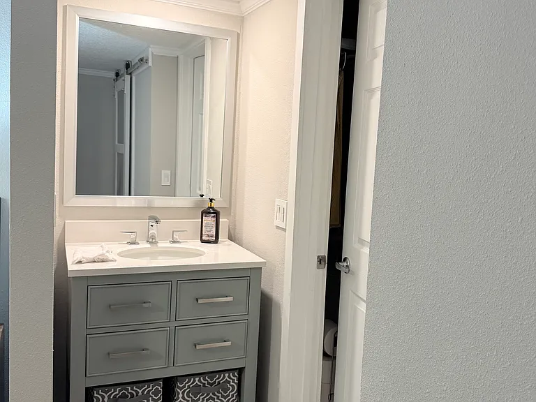 Main bedroom vanity with mirror.