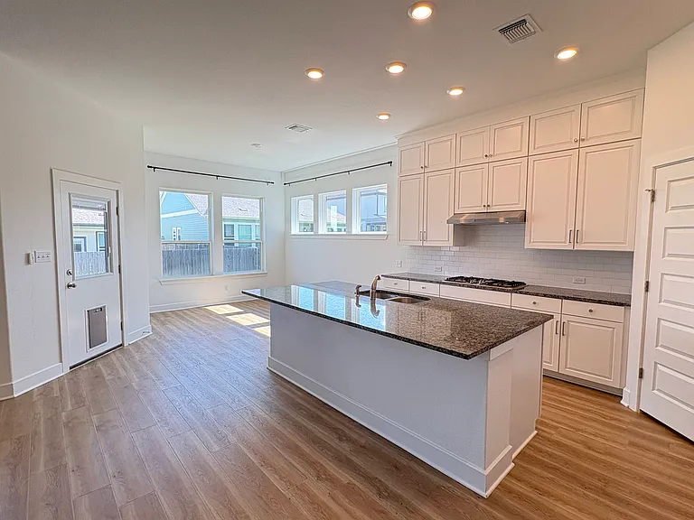 Tons of cabinet storage with open concept kitchen and dining