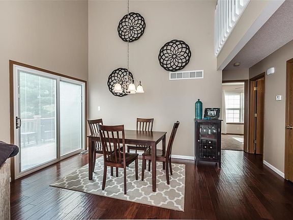 Bright, dining area overlooking deck and yard.