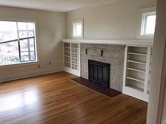 Unit Apt 2 features an exceptionally large 20'x16' Formal Living Room w/ proper Fireplace!