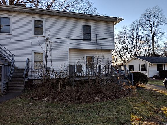 Doorway to the apartment off of the deck on the right. Upstairs right window is in bedroom one. Driveway reserved for this apartment only