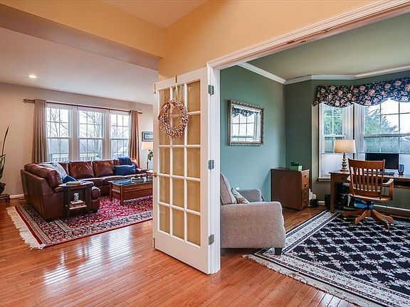 Entrance with Living Room and Office view