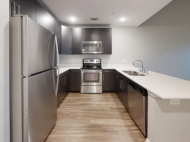 Plenty of counterspace, cabinets, and a dishwasher are featured in The Sycamore's kitchen. Plenty of counterspace, cabinets, and a dishwasher are featured in The Sycamore's kitchen.