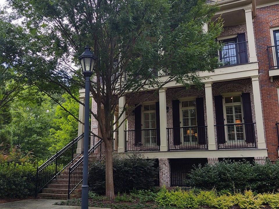 Front of townhome overlooks beautifully landscaped courtyard.