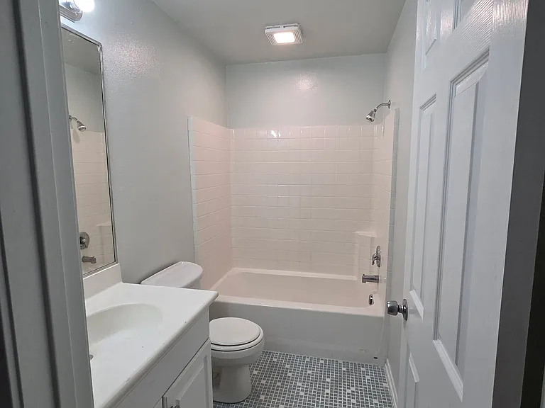 Downstairs full bathroom conveniently located next to the downstairs bedroom.