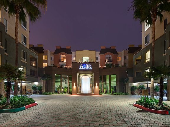 Exterior of apartment building at night.
