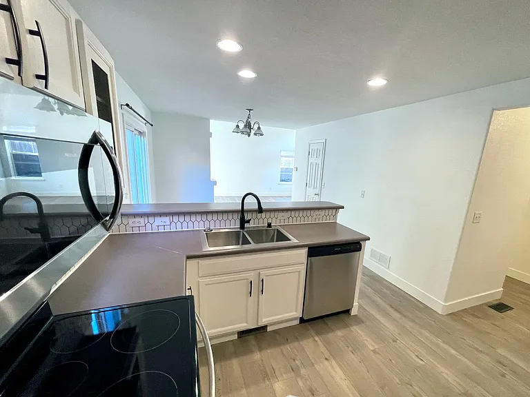 Kitchen has sight-lines all the way through to the living room