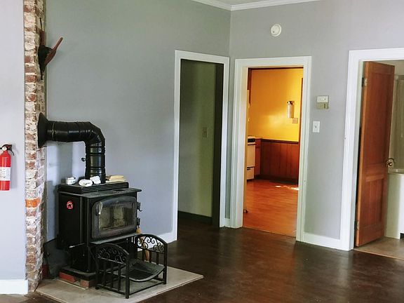 Living room. Doors leading to: 3BR & Bath, Kitchen, Second Bath