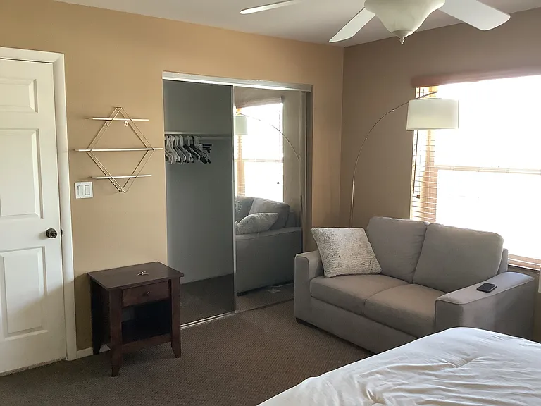 Upstairs front bedroom with private bathroom and walk-closet.