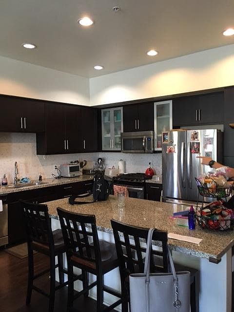 open kitchen with stainless appliances
