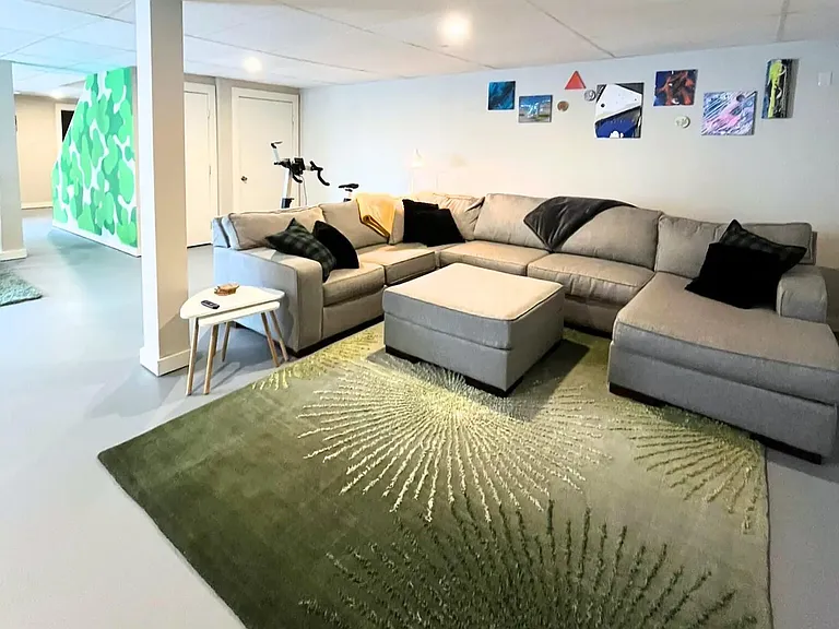 Fully furnished downstairs basement with walk-out deck, full bathroom and tons of storage.