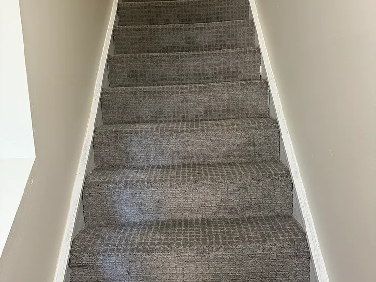 Stairs off living room lead to 2 spacious bedrooms