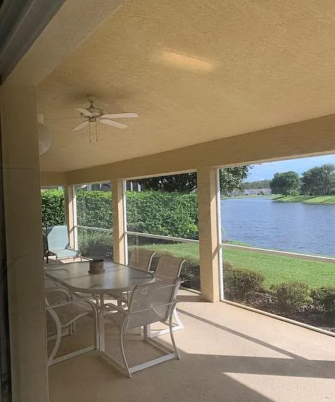 BACK LANII VIEW, SCREENED PORCH WITH FAN.