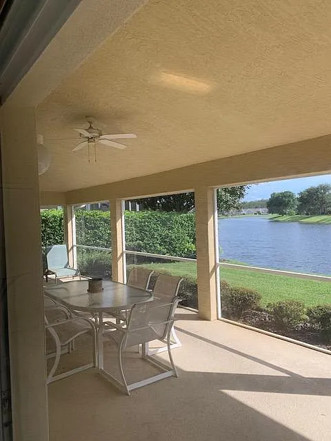 BACK LANII VIEW, SCREENED PORCH WITH FAN. - 1212 Crown Pointe Ln