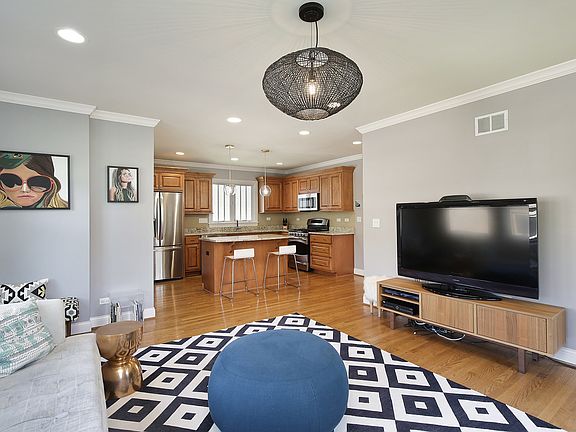 Comfortable family room opens to the kitchen creating a desirable floor plan.