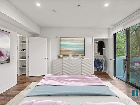 Large-Size Bedroom with Walk-In Closet with Shelving, Recessed Lighting, Vinyl Flooring, and Patio