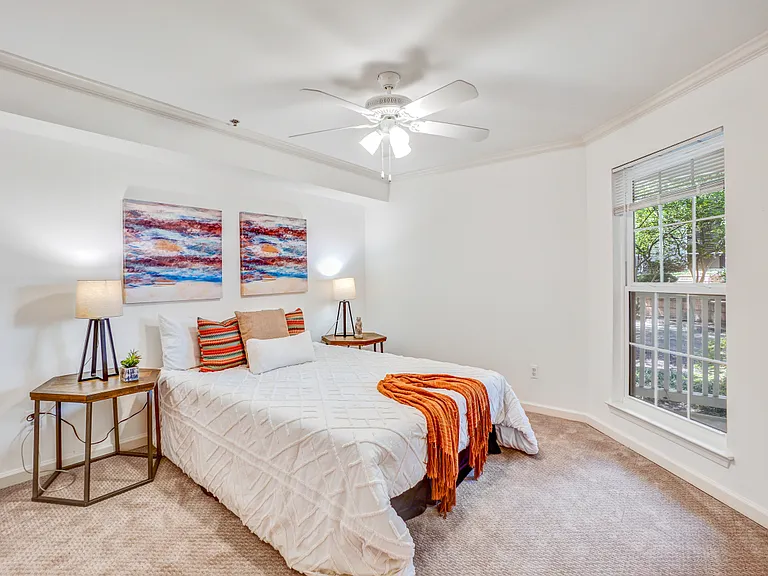 Large bedroom with ceiling fan.