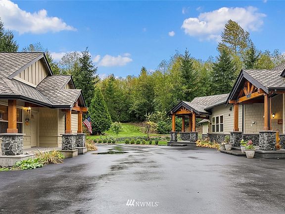 Paved & sealed driveway w/13+ covered parking. 