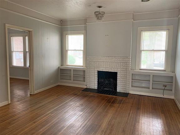 Beautiful maple hardwood floors greet you into the main living room with wood burning fireplace!
