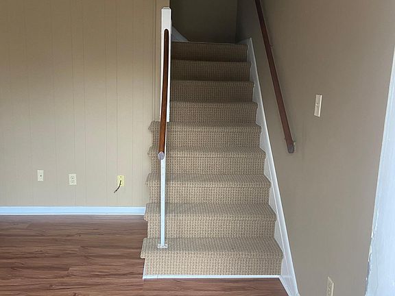 Stairwell in living area leading to the up stairs