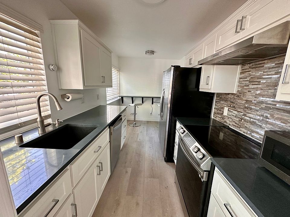 Updated kitchen with quartz countertop (all appliances shown included)