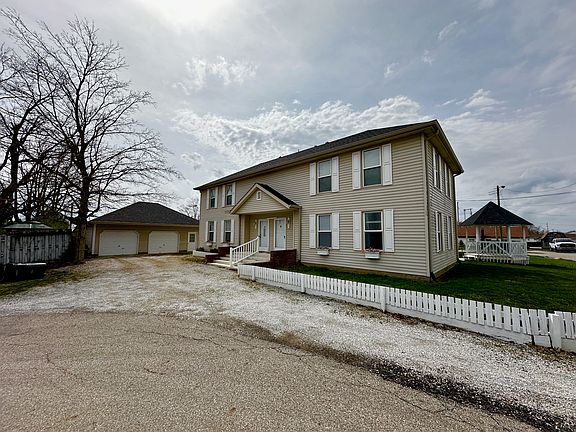 Home showing detached garage and gazebo