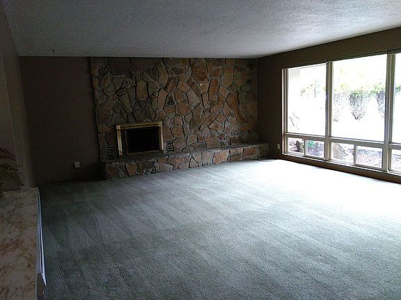 Open living room, access to serving bar on the left.. floor