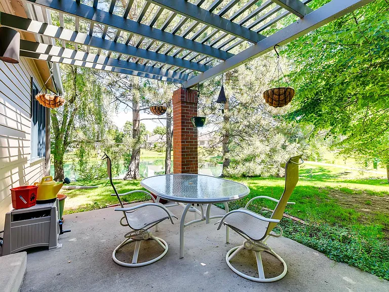 Patio with pond view and walking paths