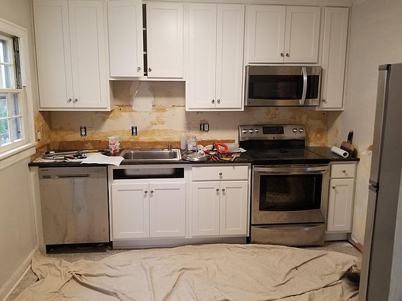 Reno in process - backsplash to be tiled; new cabinets with soft close drawers and doors; new appliances