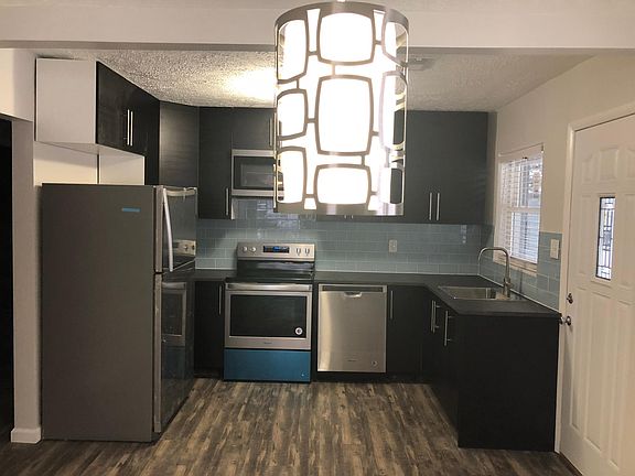 Kitchen with stainless steel appliances, including dish washer