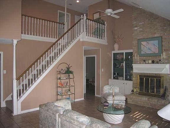 Living room with built in book shelf and storage