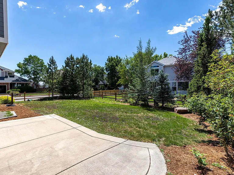 Step outside to a spacious concrete patio that flows seamlessly into the expansive backyard, creating the perfect setting for outdoor dining, entertaining, and everyday enjoyment.