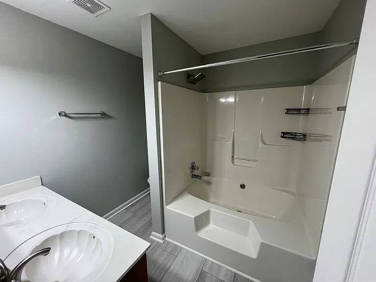 Primary bathroom with dual vanity and soaking tub/shower