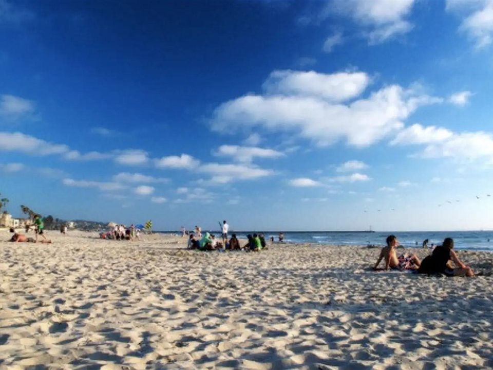 Just 15 yards from warm sandy beaches, boardwalk and ocean. Great ocean views from inside and outside the condo and from patio deck with hot tub. See additional photos.