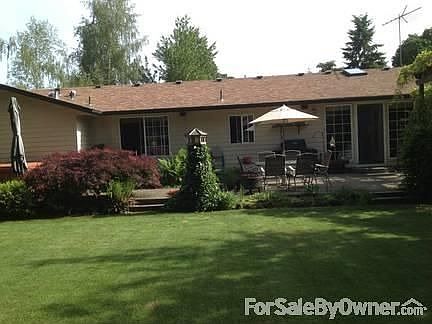 Back of House
						:
						Landscaped yard with two patios: one off family room, other off Master Bedroom.
