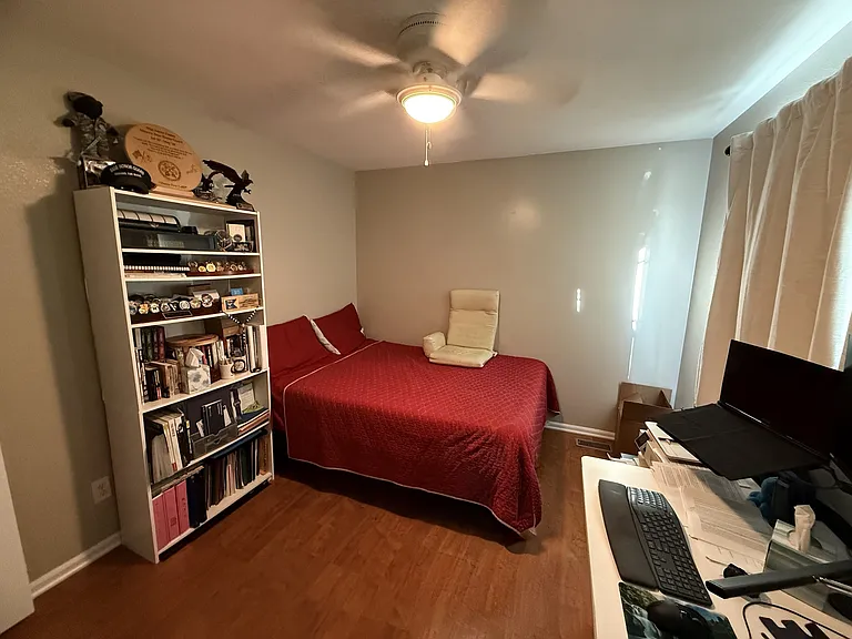Second Bedroom with large closet, large windows, and ceiling fan.