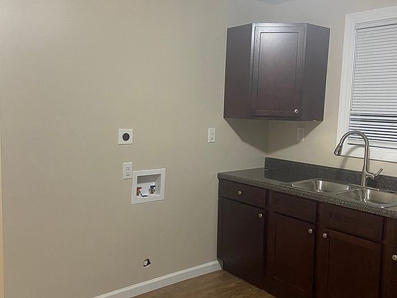 Newly updated kitchen featuring elegant granite countertops, abundant cabinet space for all your storage needs, washer/dryer hookups, and a gas stove hookup, perfect for home chefs.