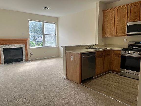 Great room with gas fireplace (new carpeting)