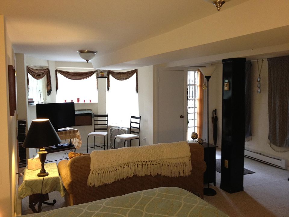 View toward the front door and front bay window.